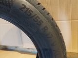 a close up of a tire on a wooden floor next to a cardboard box