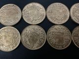 six different british silver coins, one of which has a crown on it