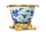 an image of a blue and white vase with a gold rim