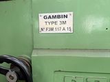 a close up of a green machine with a steering wheel