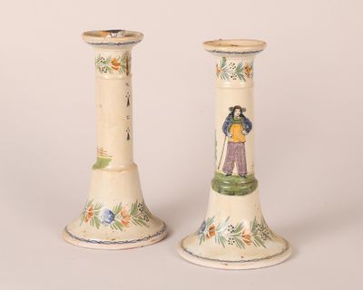 two vases that have been painted with people on them
