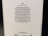 the back of a white box with a green label on it