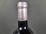 a bottle of wine that is sitting on a table