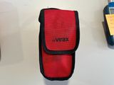 a red case with a name on it next to a cell phone