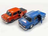 two toy cars that are next to each other on a white surface