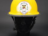 a close up of a yellow fireman ' s helmet on a mannequin head