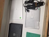 a box with a laptop and other electronics inside of it