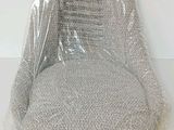 a plastic chair that is wrapped up and ready to be used