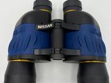 a close up of a pair of binoculars on a white surface