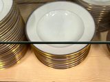 a glass display case with a lot of plates on it