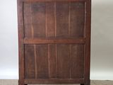 an old wooden cabinet with a drawer on top of it