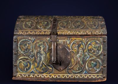 an old wooden box with a lock on it