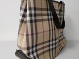 beige and black checkered purse with black leather handles