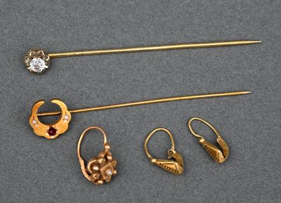 three pairs of gold earrings and a pair of gold broochers