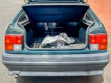 a trunk of a car with a blanket in it