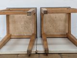 two pieces of wood sitting on top of each other