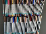 a lot of pens that are sitting on a table