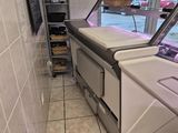 tiled floor in a restaurant with a refrigerated counter in the middle