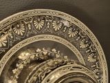 a close up of a plate with a decorative design on it