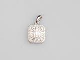 a white gold and diamond pendant