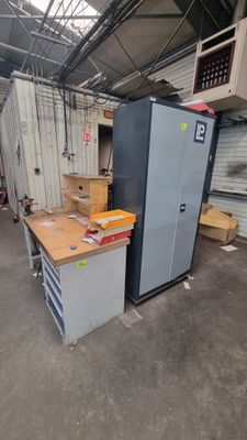 a refrigerator and a freezer in a warehouse