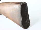 an old gun with a wooden barrel on a white background