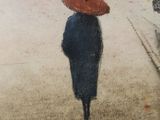 a painting of a person with an umbrella walking down the street