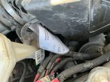 a close up of a car ' s engine with the hood open