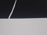 a black and white photo of a piece of paper with writing on it