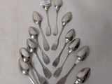a lot of spoons and forks arranged in a tree shape