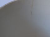 a blue and white bowl sitting on a table