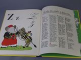 an open book with a picture of a mouse and a zebra
