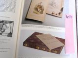 an open book with a picture of a cat on it