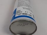 a can of soda sitting on a white surface