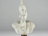 a white marble bust of a woman with a crown on her head