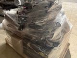 a pile of electronic equipment sitting on top of a pallet