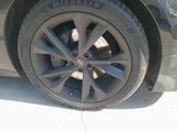 a close up of a tire on a car ' s rim