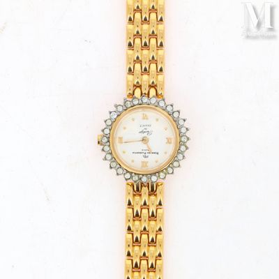 a close up of a gold watch with diamonds on the bracelet