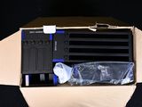 a cardboard box with a computer in it on a black background