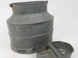 a large metal container with a lid and a smaller metal container with a lid
