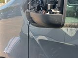 the side view of a van with the door open and the driver ' s side door open