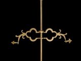 an image of a golden candle holder with candles on top of it