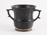 a black vase with two handles on a white background