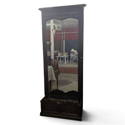 a tall mirror that is sitting on the floor
