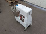a machine that is sitting on the ground next to a pallet