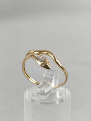 a close up of a gold ring with a diamond in the middle