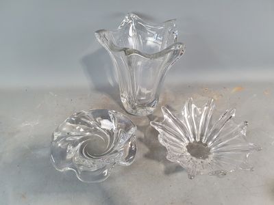 three pieces of glass sitting on a counter top