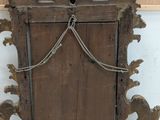 an old wooden door with a chain hanging from it