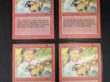 four cards with a picture of a man holding a baseball bat