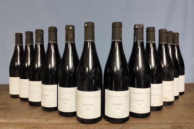 six bottles of wine are lined up in a row on a table